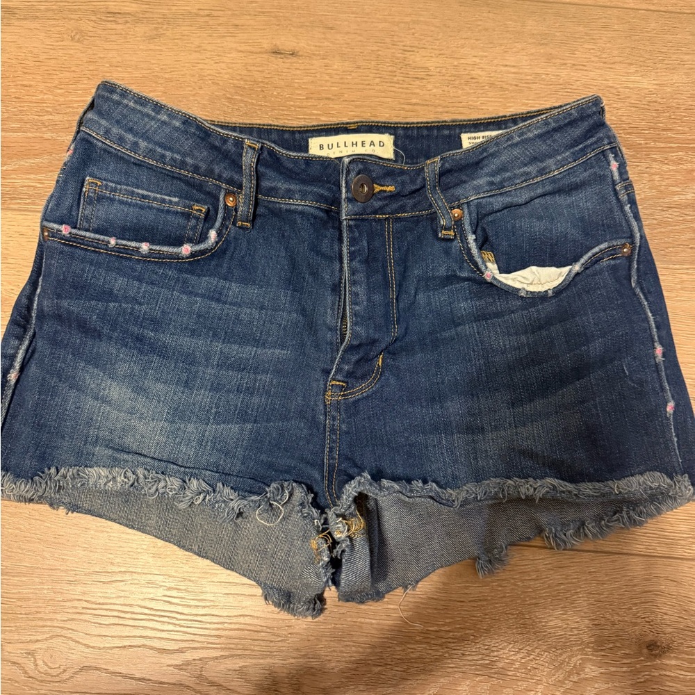 Bullhead Denim Cutoff Shorts in Dark Blue with Pink Stitching